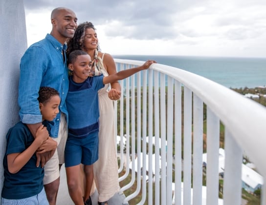 A family is looking out from the light house.