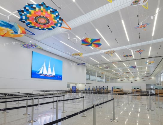 Interview of the LF Wade airport with colourful kites on the ceiling.