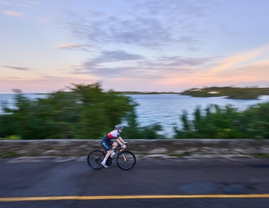 A woman is cycling on harbour road