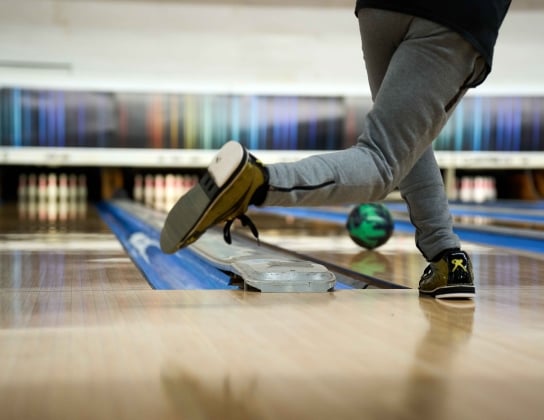 A person is bowling 