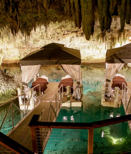 Spa massage beds on a floating dock in a cave in Bermuda
