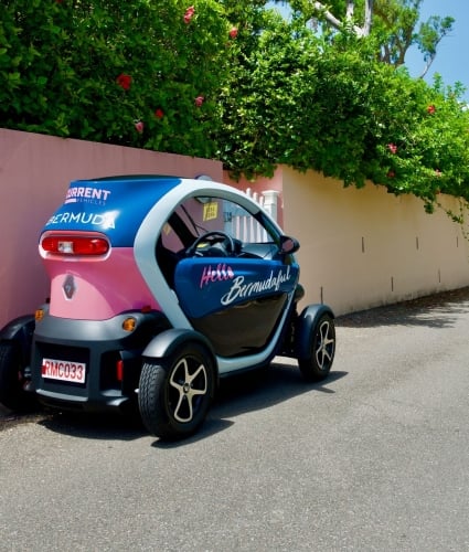 Twizy rental car parked on side street