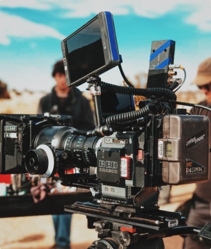 close up of a film camera shooting a scene