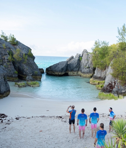 Triathletes taking pictures of the Bermuda coastline