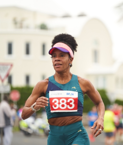 A woman is running a race.