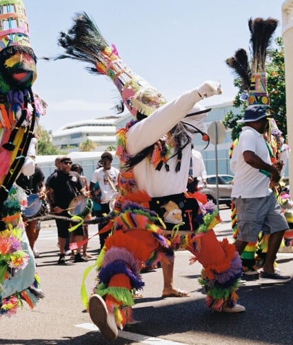 Bermuda's Gombey dance troupes, decked out in colourful regalia, playing drums, beer-bottle fifes and tin whistles.