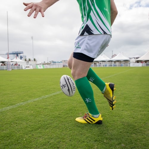 Rugby player kicking off