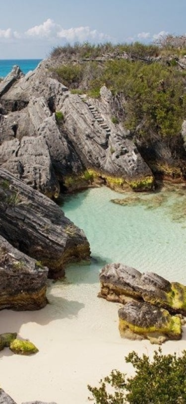 aerial view of large rocks on beach