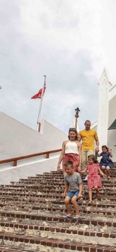 A family walking down church stairs in Bermuda