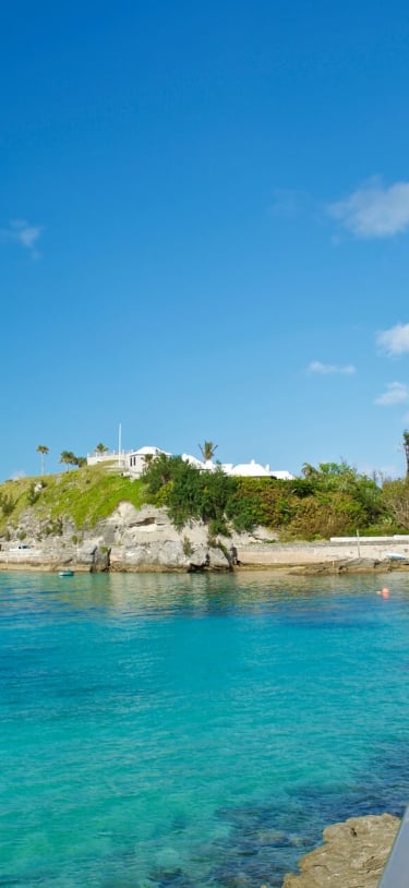 wooden bridge crossing over a body of water along the Bermudian coastline