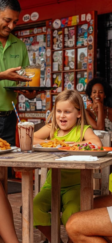 A family is eating at the Swizzle In.