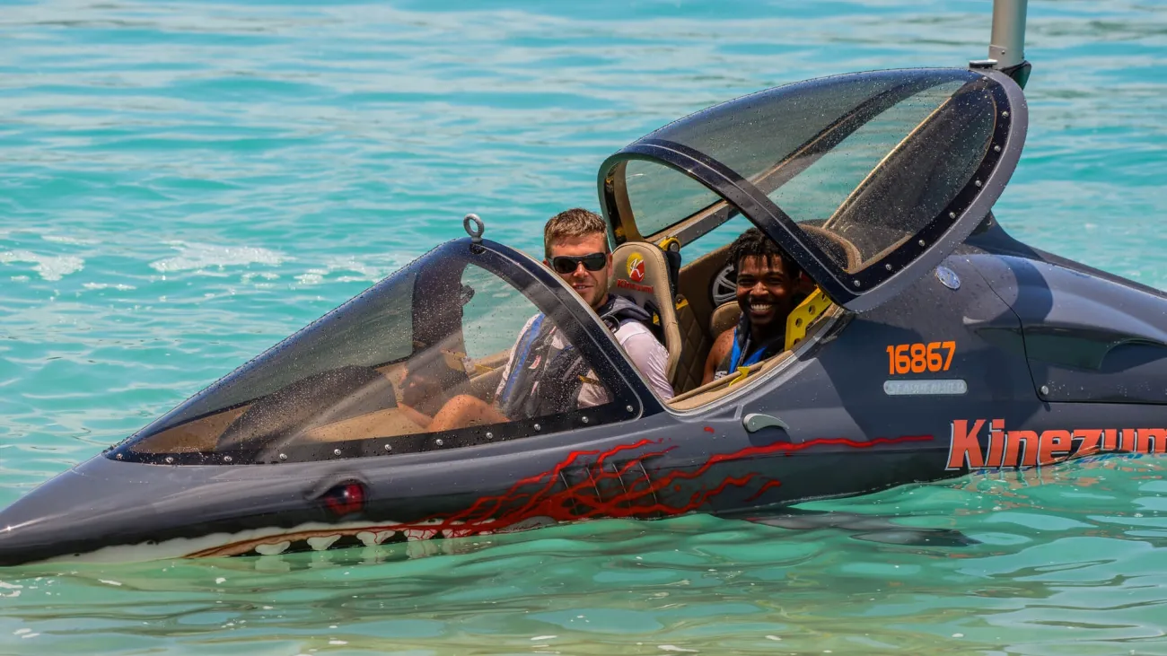 Two people in an aquatic vehicle in the Bermuda waters