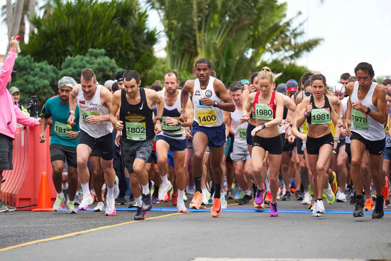 A group of people are getting ready to run a 1/2 marathon.