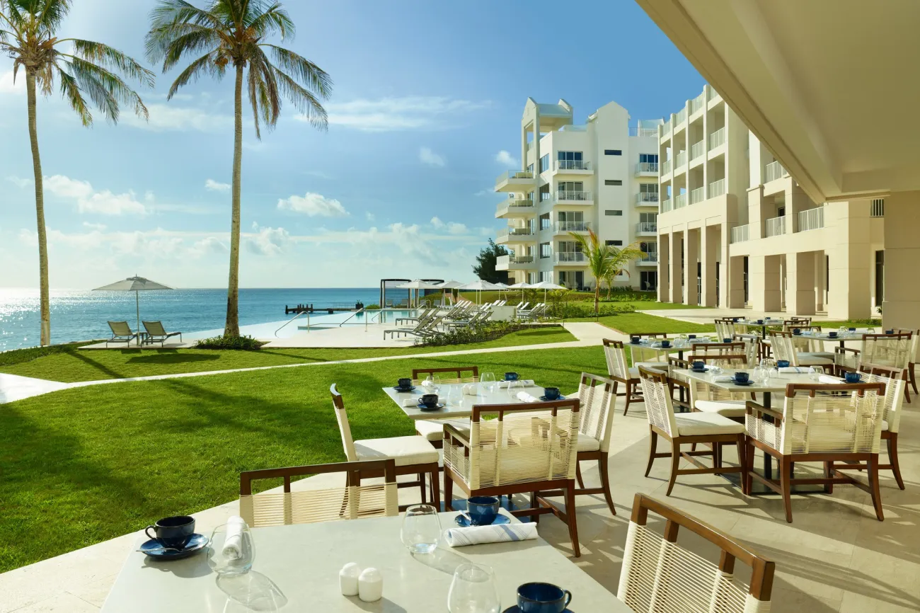 Exterior view of St Regis Bermuda with a restaurant and ocean views. 
