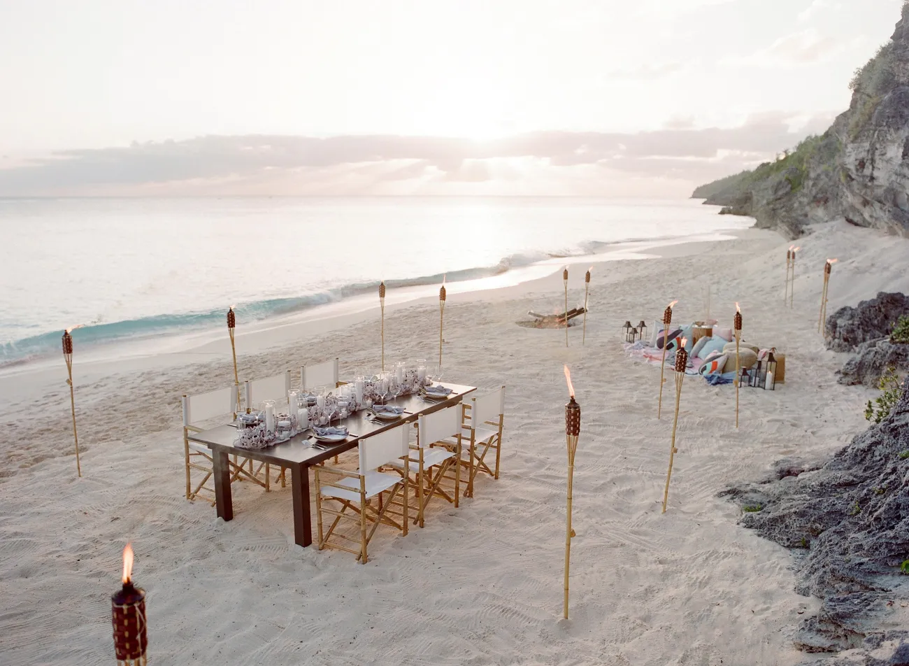 A beach set up of a dinner party.