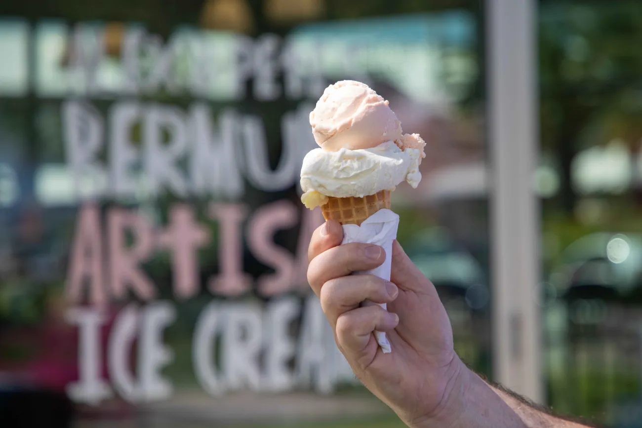 A close up of ice cream in front of a store.