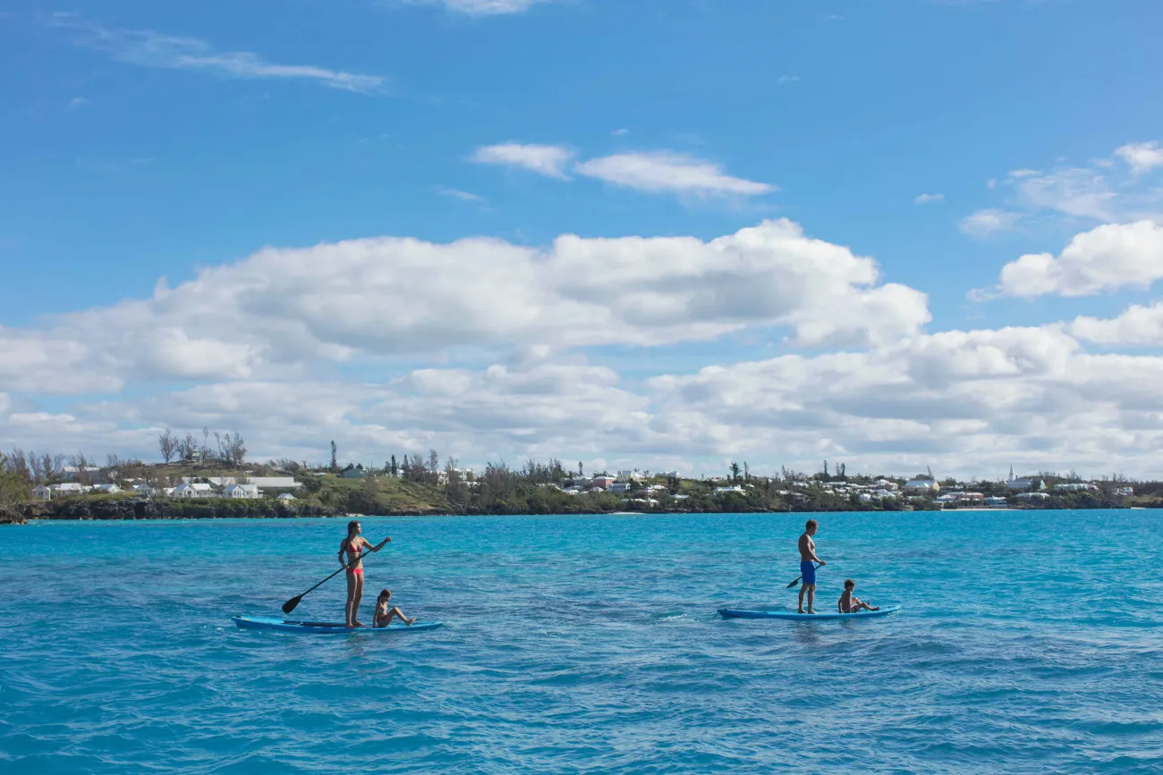 A family is paddleboarding by the Vixen