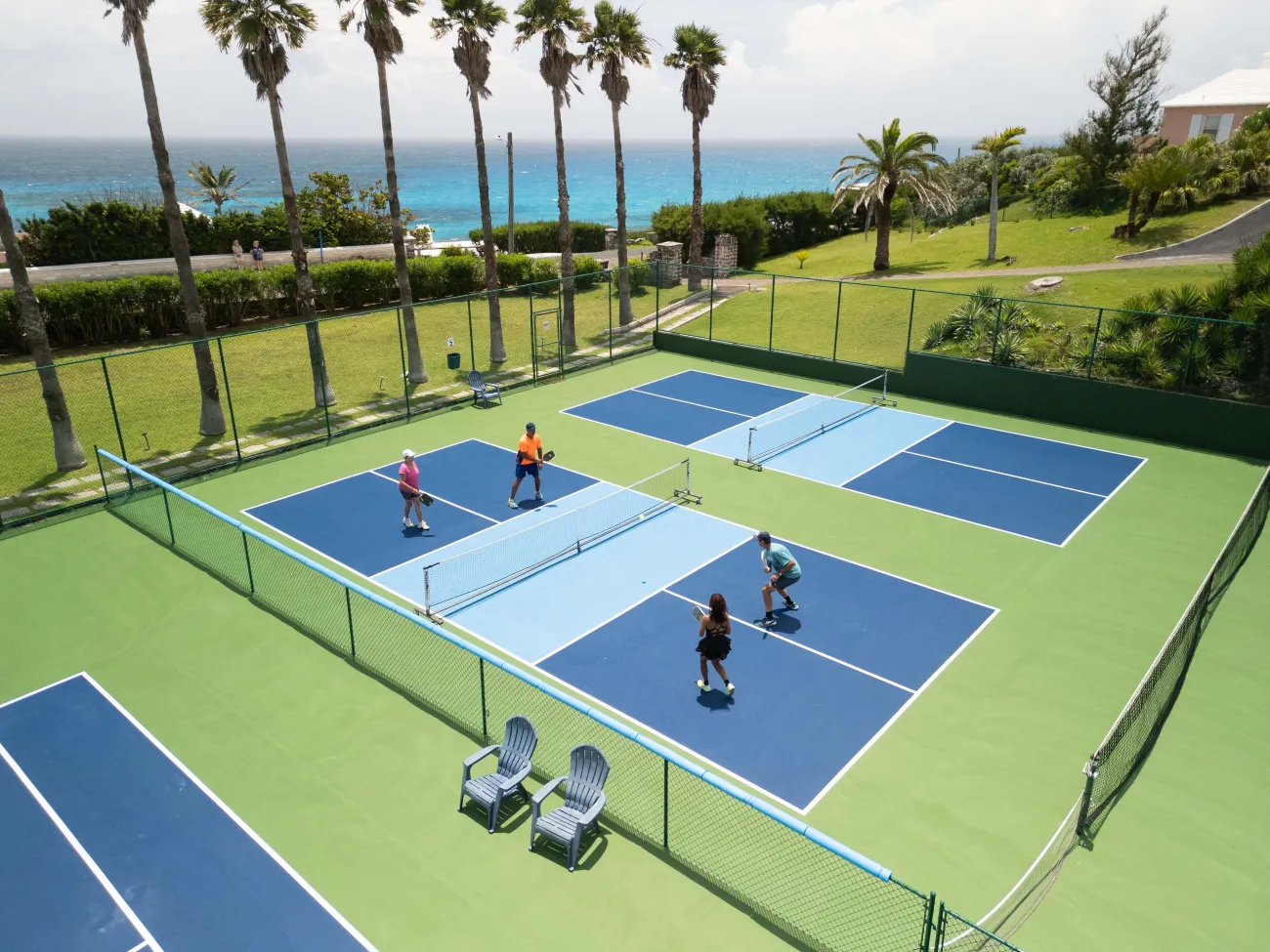 An aerial view of a group of people are playing pickleball.