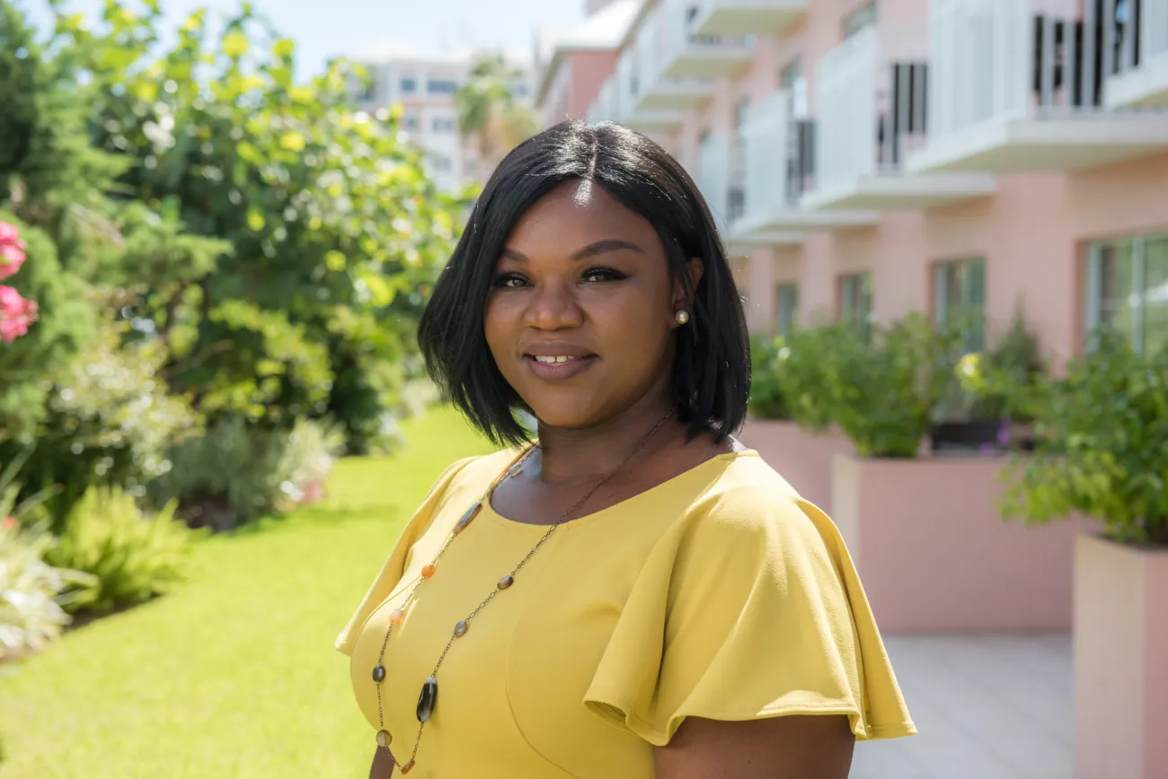 A woman is smiling at the camera.