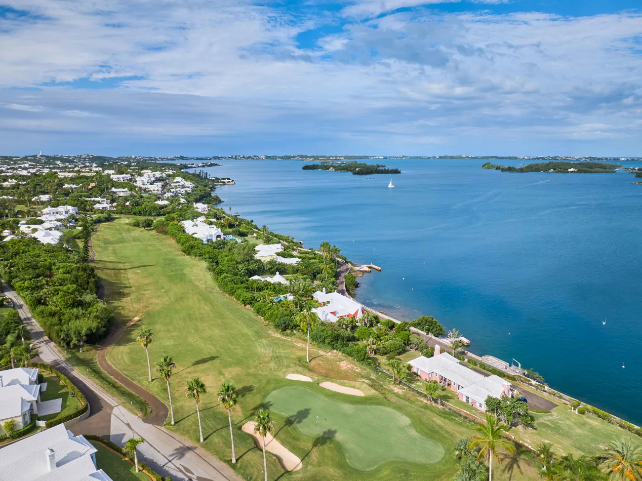 Aerial of newstead belmont hills with a sail boat floating by.