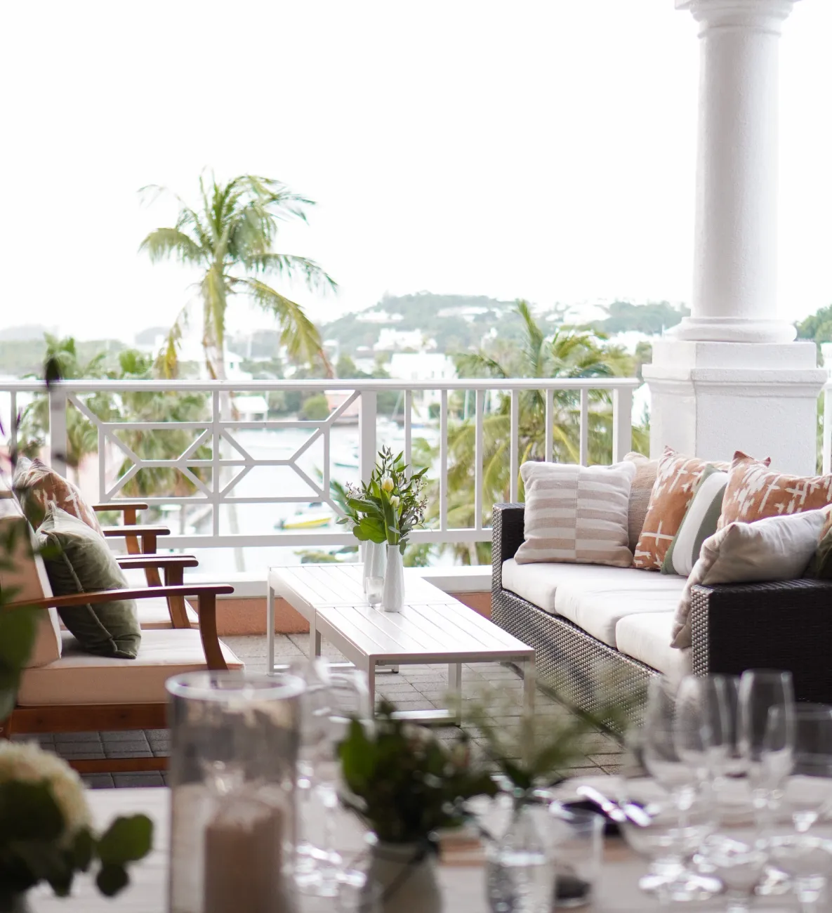 Two couches with a water view in the back.