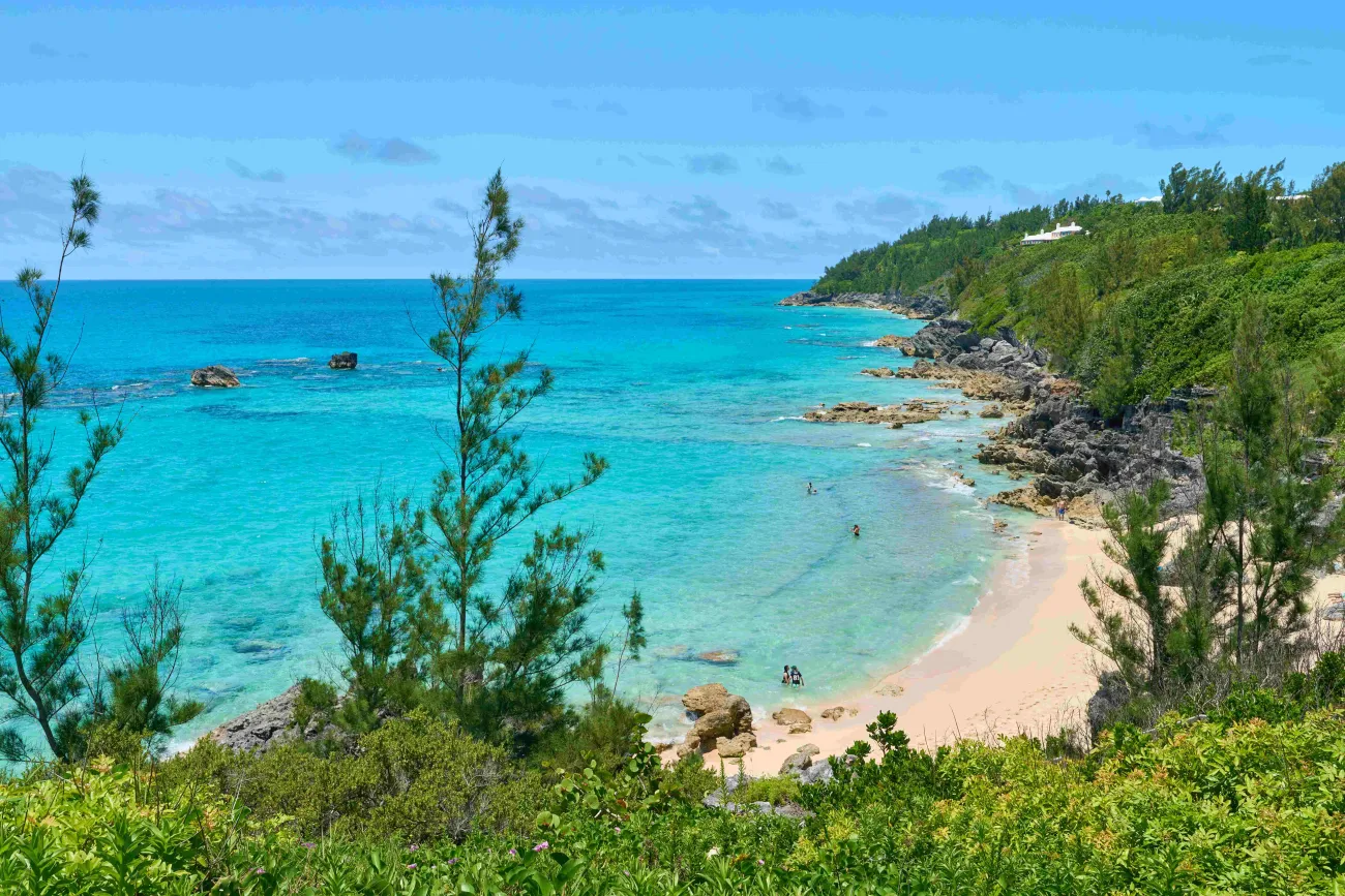 Aerial view of people swimming at the quiet Church Bay.