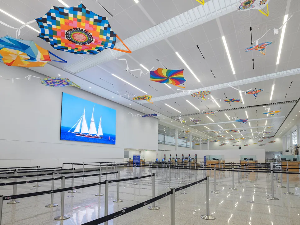 Interview of the LF Wade airport with colourful kites on the ceiling.