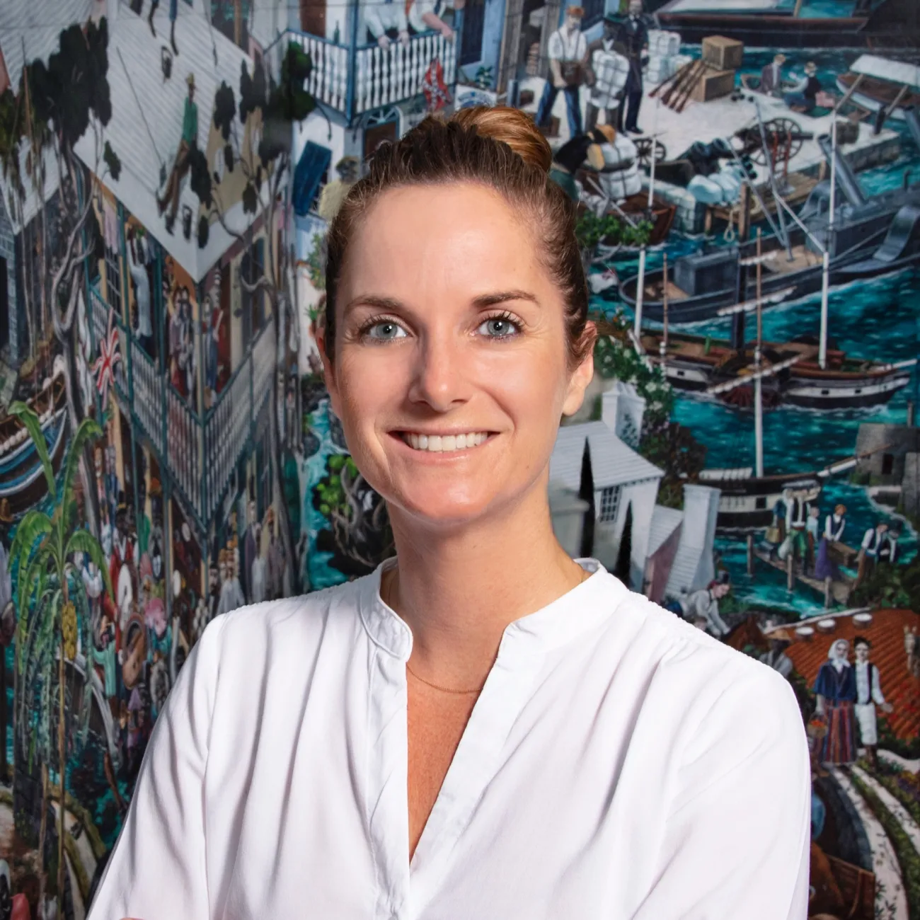 A woman is smiling at the camera.