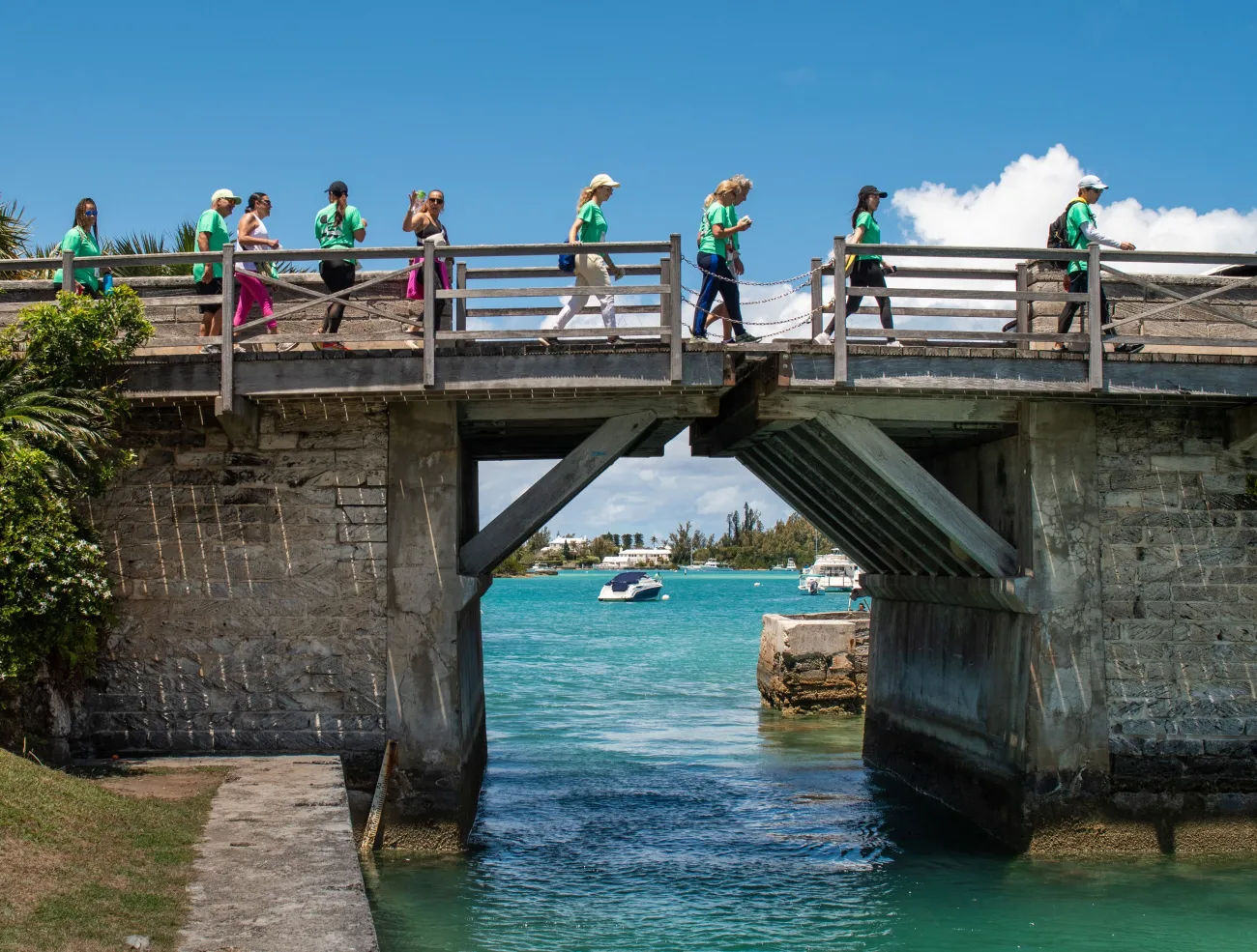 People are walking along the Somerset Bridge during the End to End.