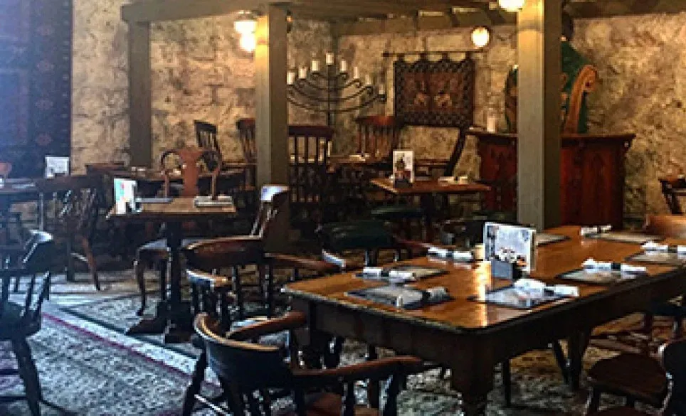 Restaurant setting with wooden tables and chairs