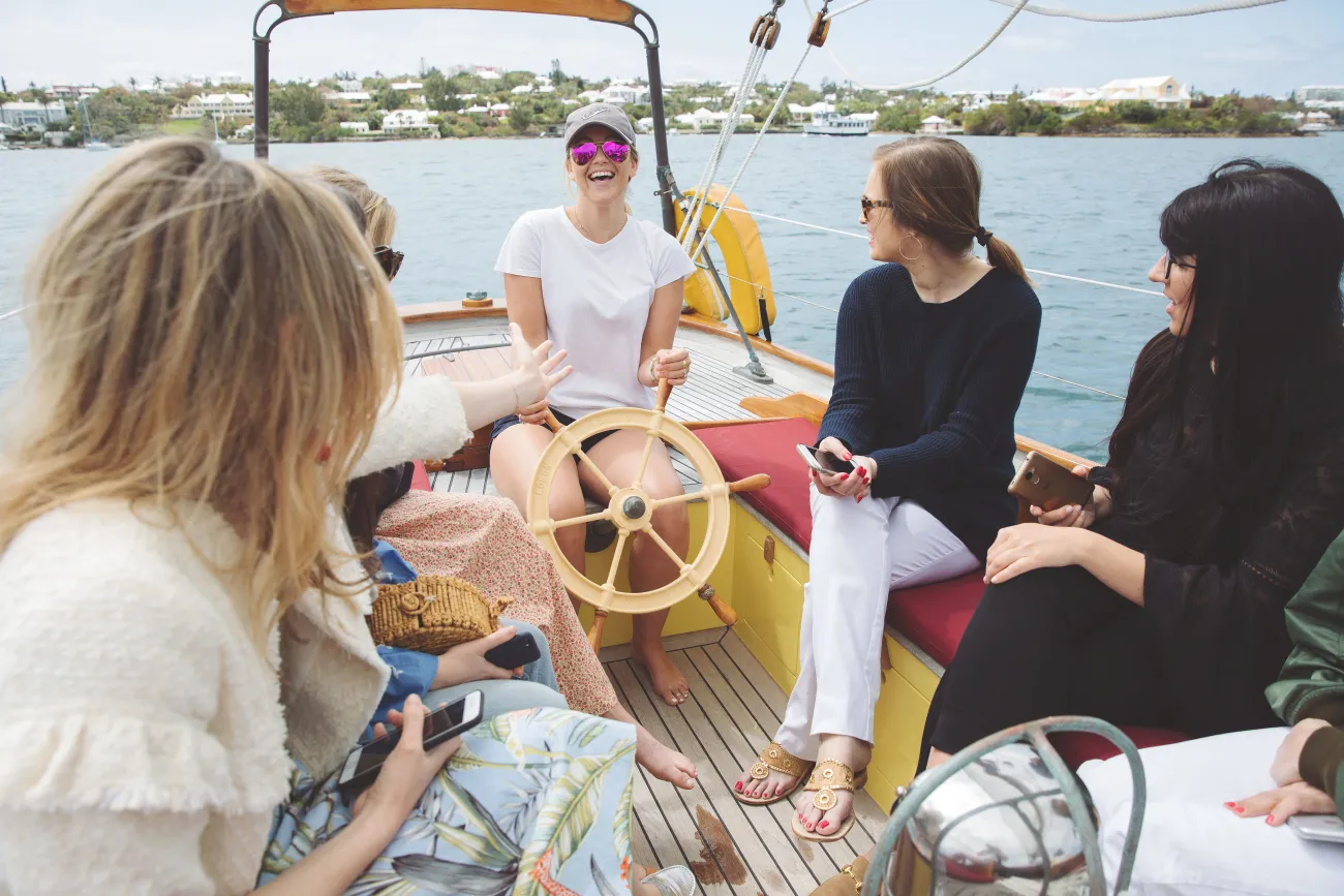 group of women laughing on a boat tour