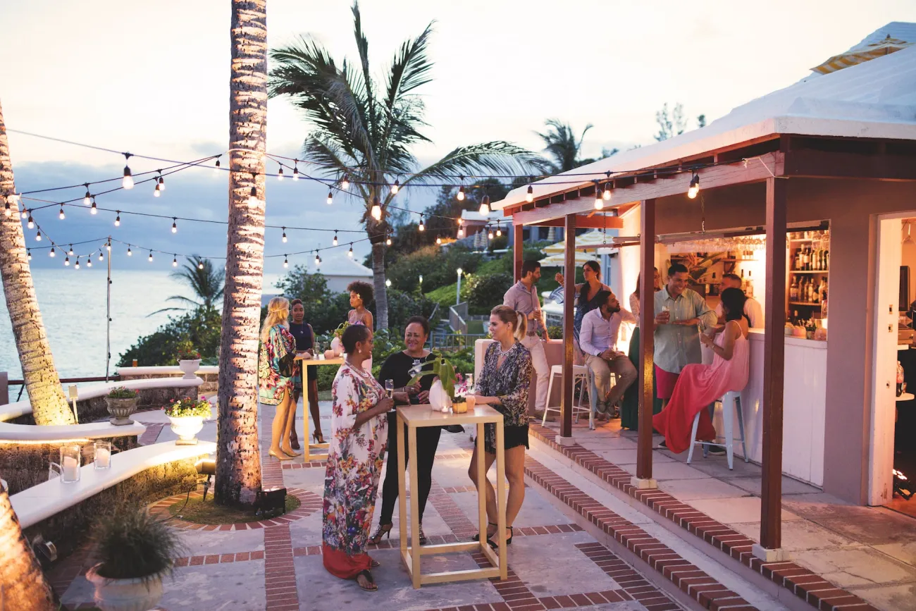 A group of people at an outdoor bar in Bermuda