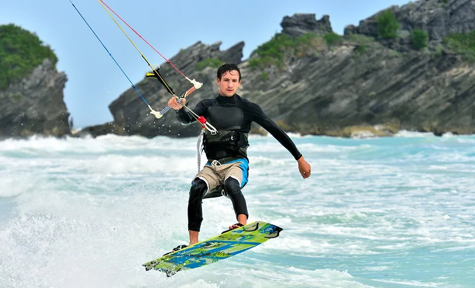 Kite surfer catching a wave