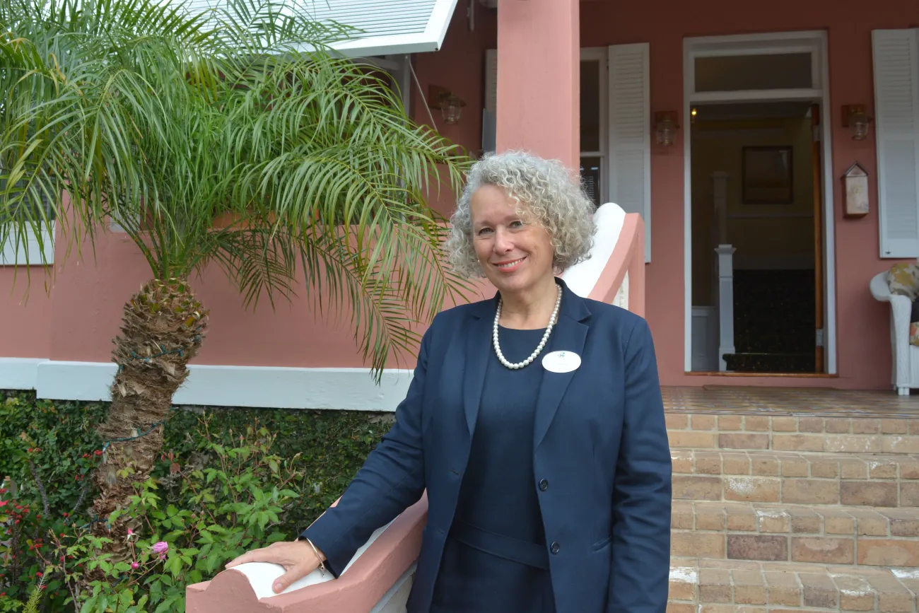 A woman is smiling at the camera.