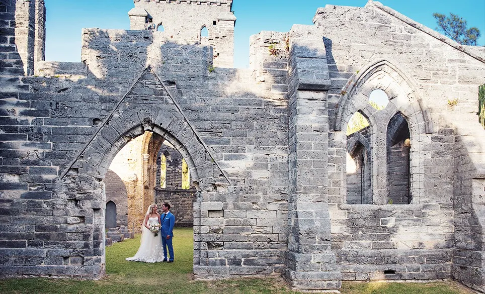 couple getting married in unfinished church