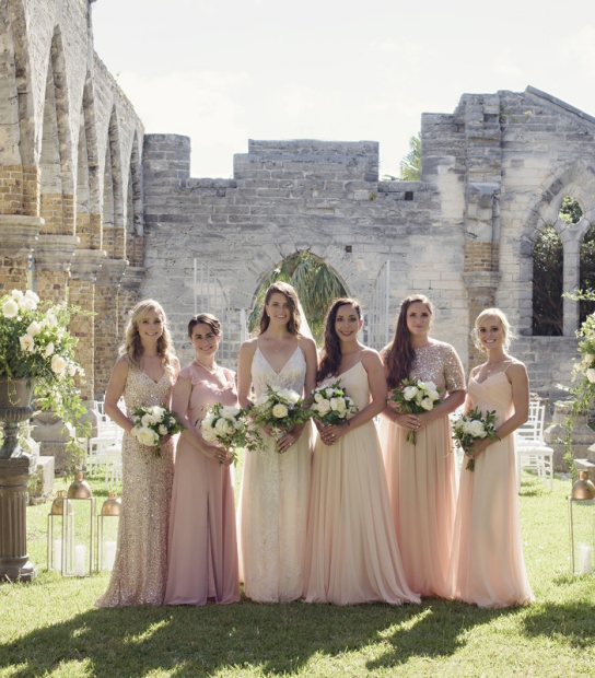 bridesmaids posing with bouquets 