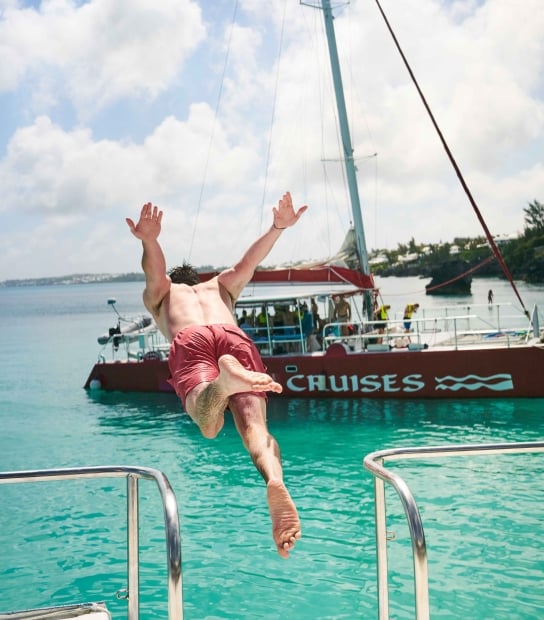 A man is diving into the water. 