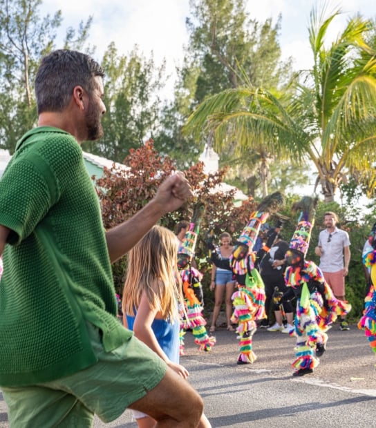 A family is dancing with Gombeys