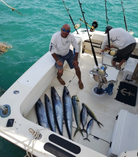 Atlantic Spray Charters – Captain With Fish
