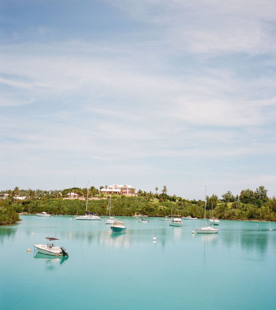 A group of boats sitting in the ocean in Bermuda