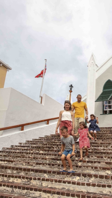A family walking down church stairs in Bermuda