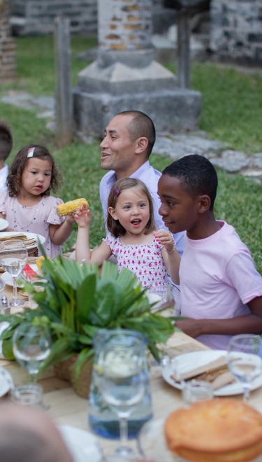 A family enjoying dinner in Bermuda 