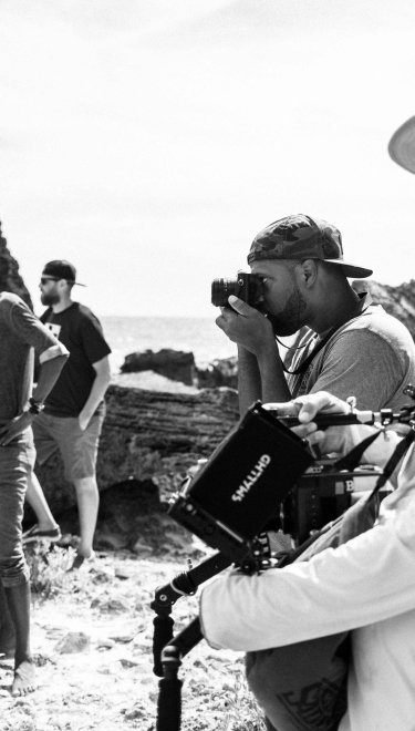 A wide shot of a group of camera people.
