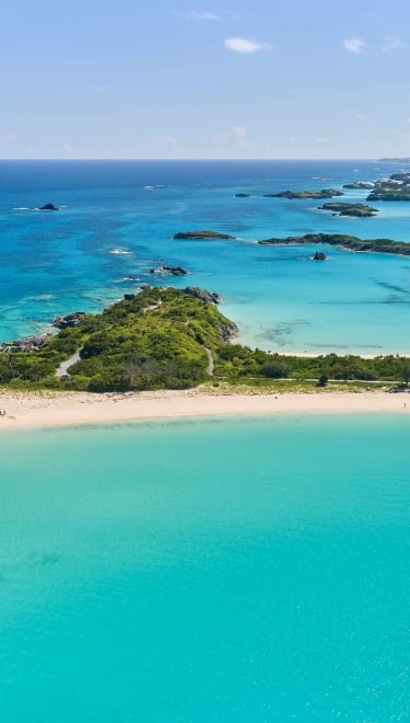 An aerial view of Cooper's Island with various beaches and Non Such Island