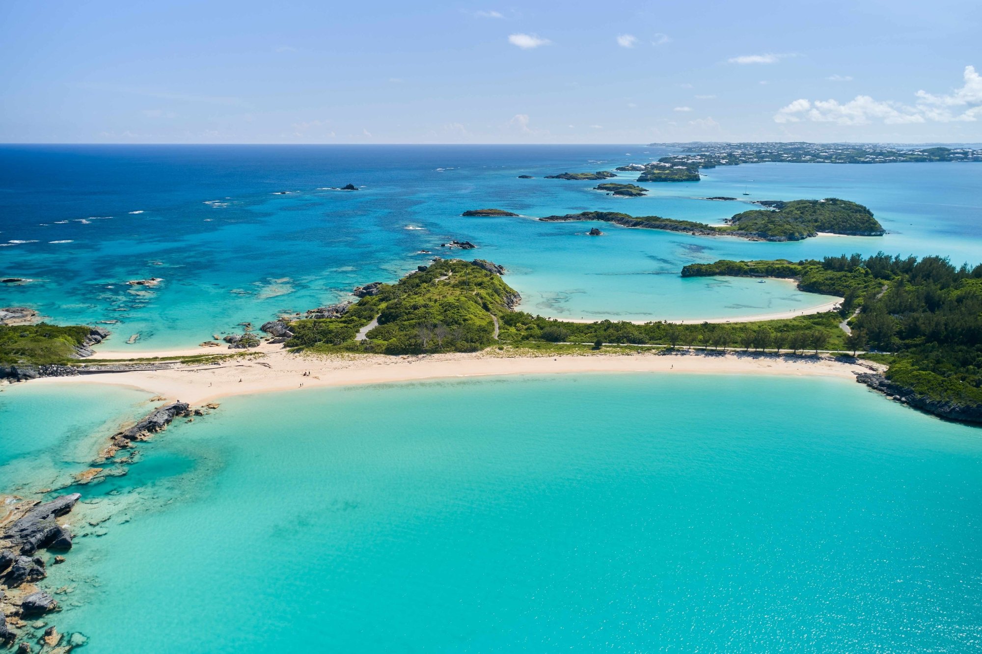 An aerial view of Cooper's Island with various beaches and Non Such Island