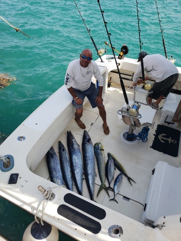Atlantic Spray Charters – Captain With Fish