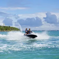 A couple rides on a jet ski in Bermuda