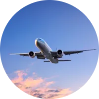 A plane flying through a blue sky